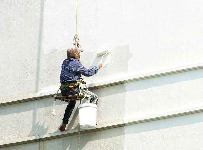 painter-hanging-white-building_34263-108